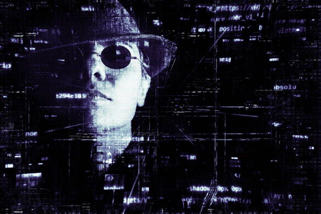 Hacker wearing sunglasses and hat, smoking cigarette with computer code in the background