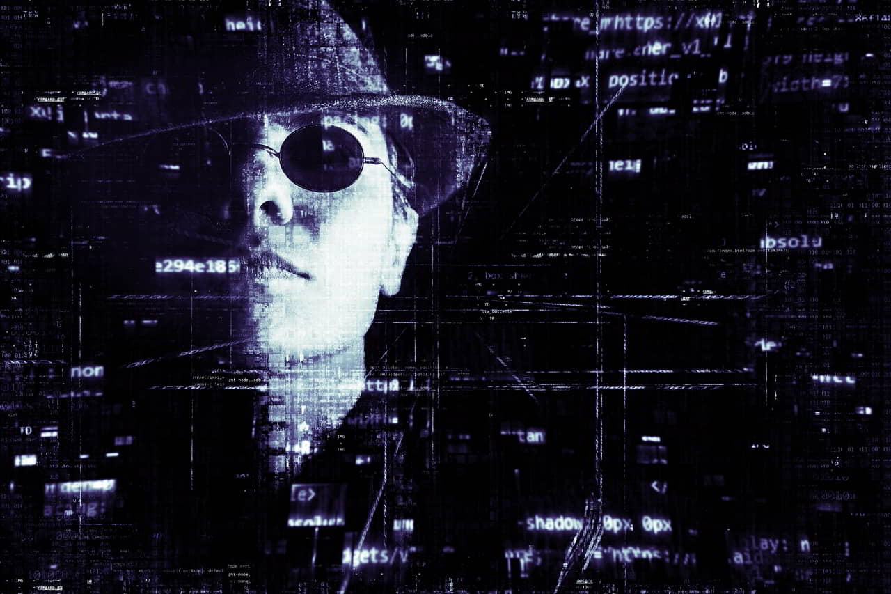Hacker wearing sunglasses and hat, smoking cigarette with computer code in the background
